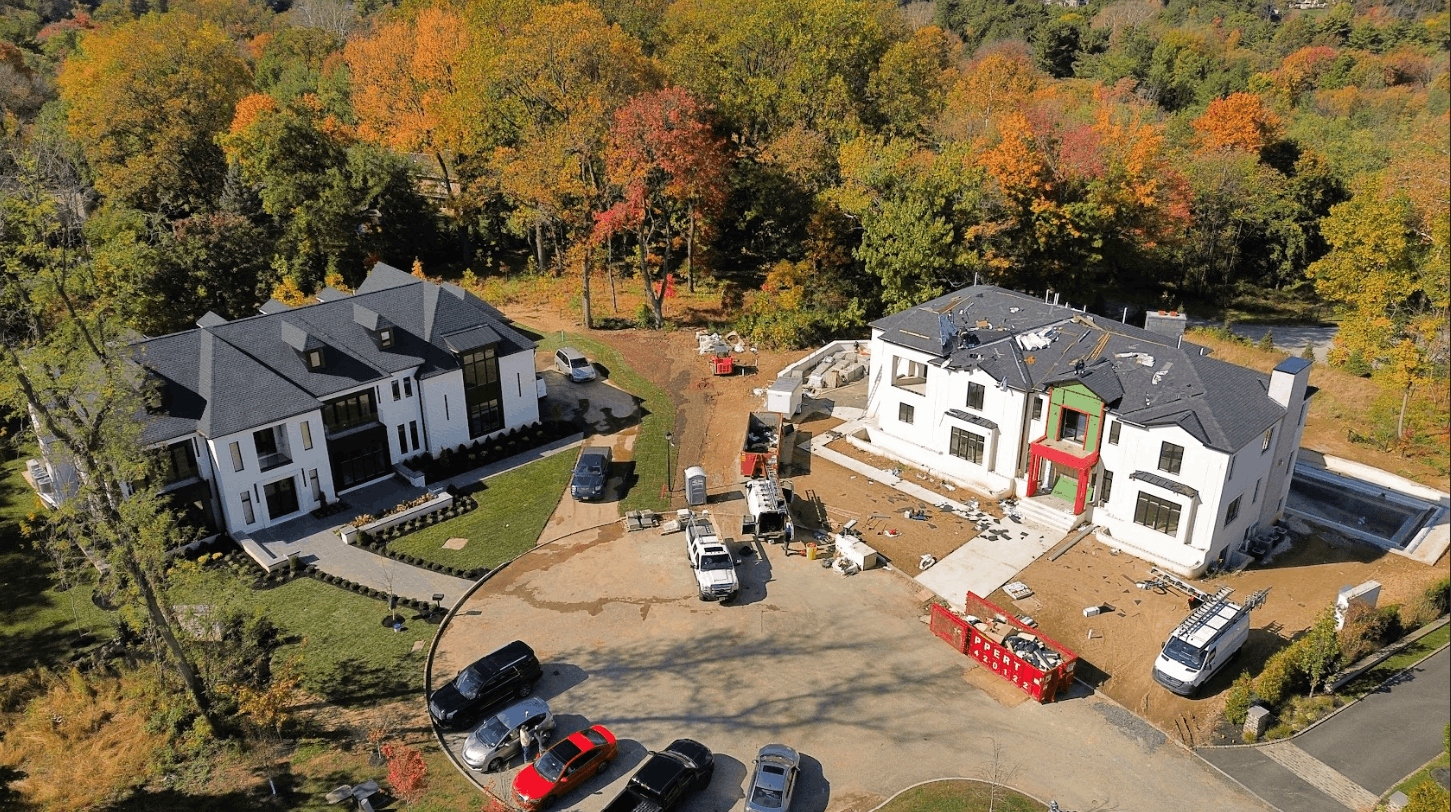 Aerial view of two homes under construction side by side