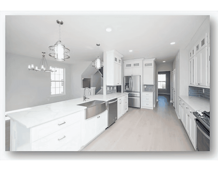 White kitchen remodel with stainless appliances